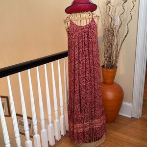 Idano beautiful cream colored dress with small red flowers and black on leaves